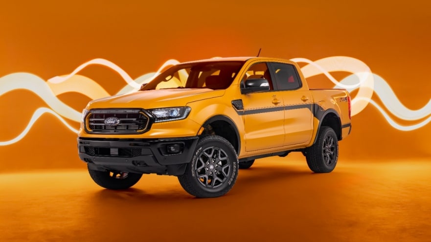 A yellow 2022 Ford Ranger Splash pickup truck against an orange background.