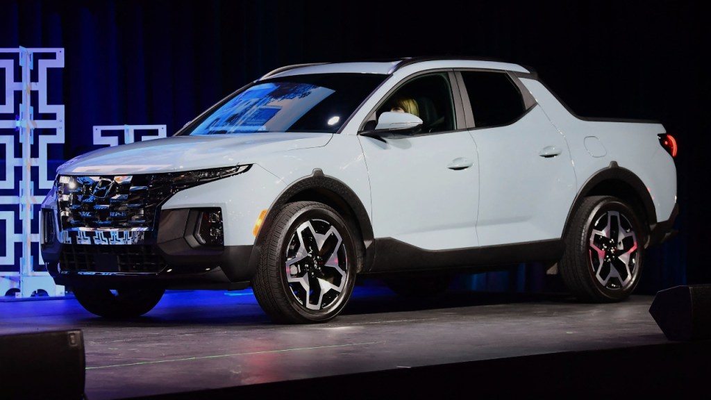 A white 2022 Hyundai Santa Cruz is on display. 