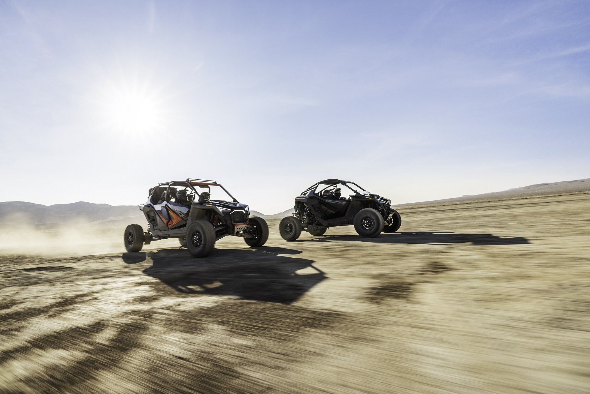 A 2022 Polaris RZR Pro R Ultimate and RZR Pro R 4 Ultimate speed through the desert