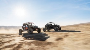 A 2022 Polaris RZR Pro R Ultimate and RZR Pro R 4 Ultimate speed through the desert