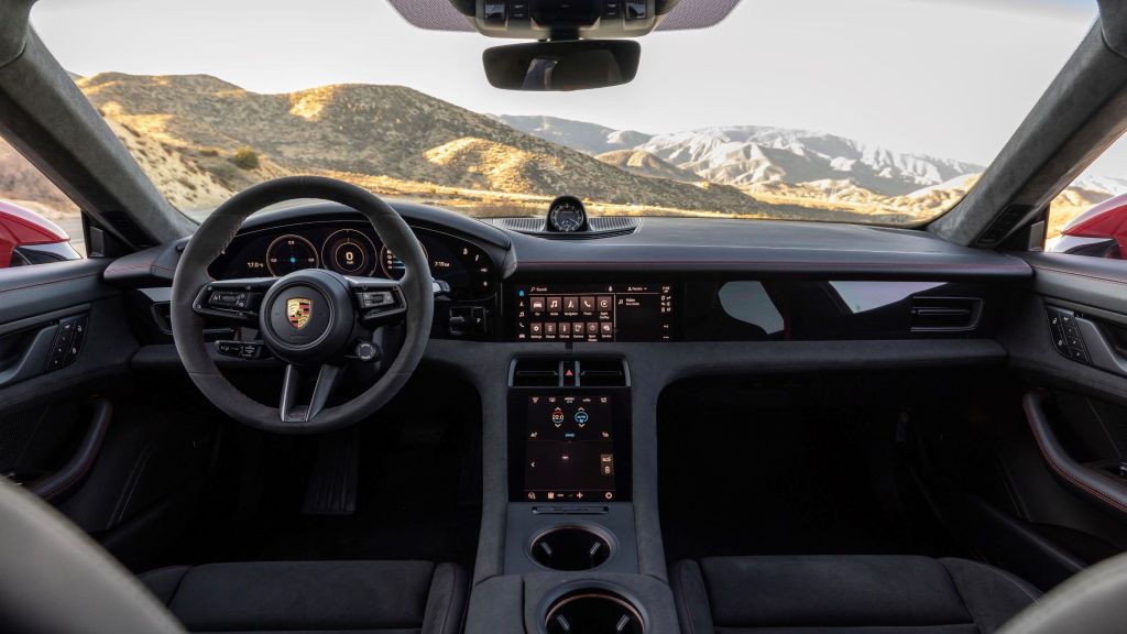 The gray front seats and dashboard of a 2022 Porsche Taycan GTS Sport Turismo
