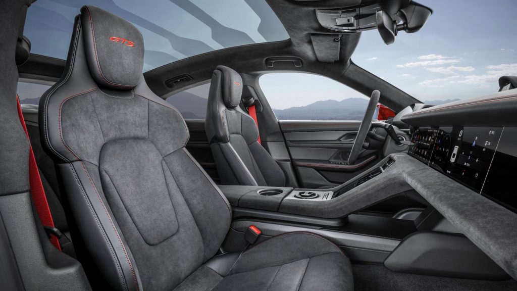 The gray-and-red front seats and dashboard of a 2022 Porsche Taycan GTS