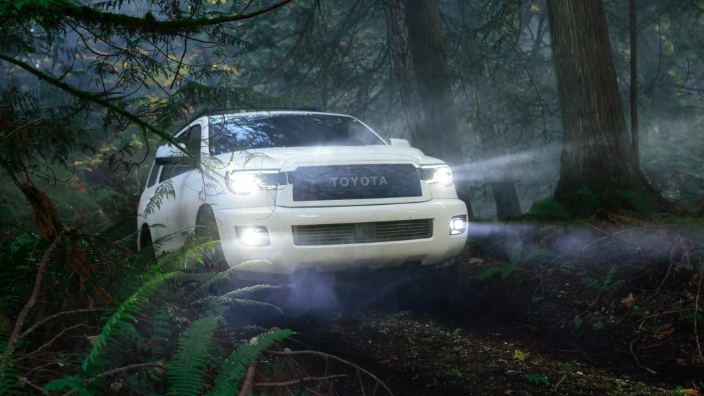 A white 2022 Toyota Sequoia TRD Pro takes on a forest trail, it's the only Toyota SUV with a V8 engine.