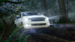 A white 2022 Toyota Sequoia TRD Pro takes on a forest trail, it's the only Toyota SUV with a V8 engine