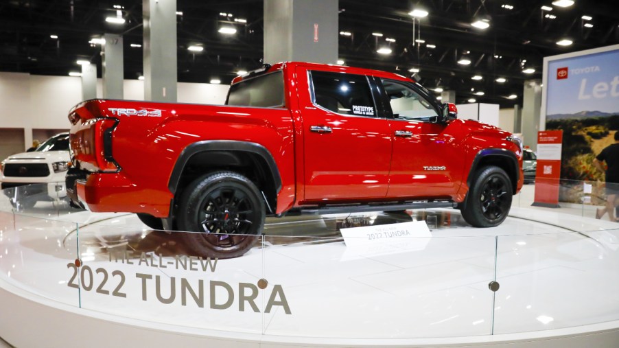 A red 2022 Toyota Tundra pickup truck is on display.