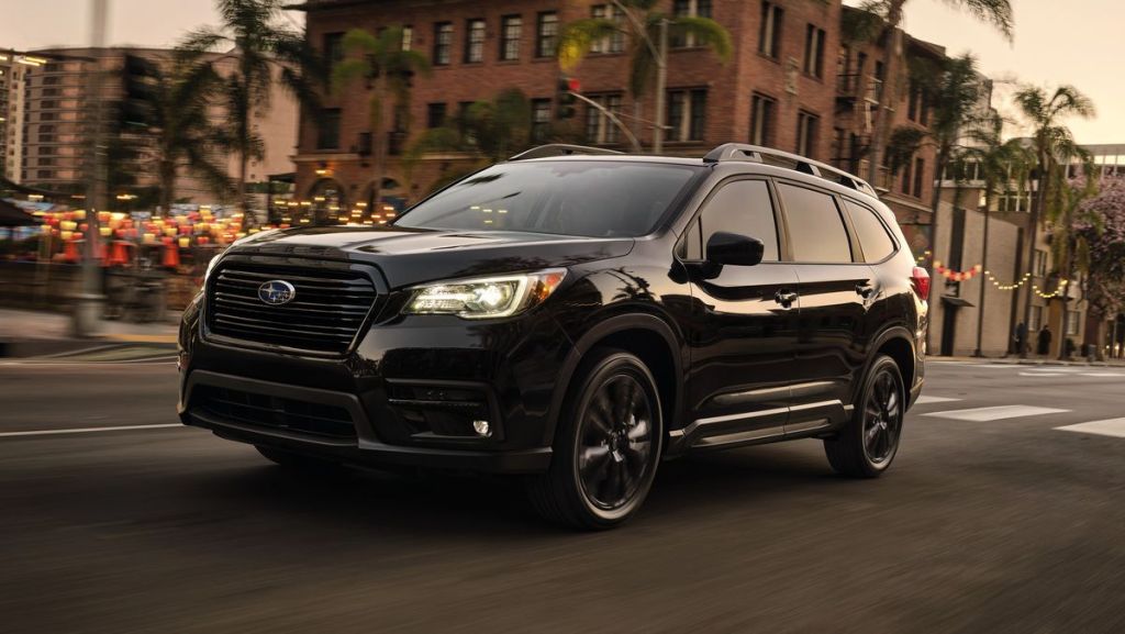 This black 2022 Subaru Ascent driving on the road is newer and the kinks aren't worked out, making it one of the least reliable 2022 SUVs.