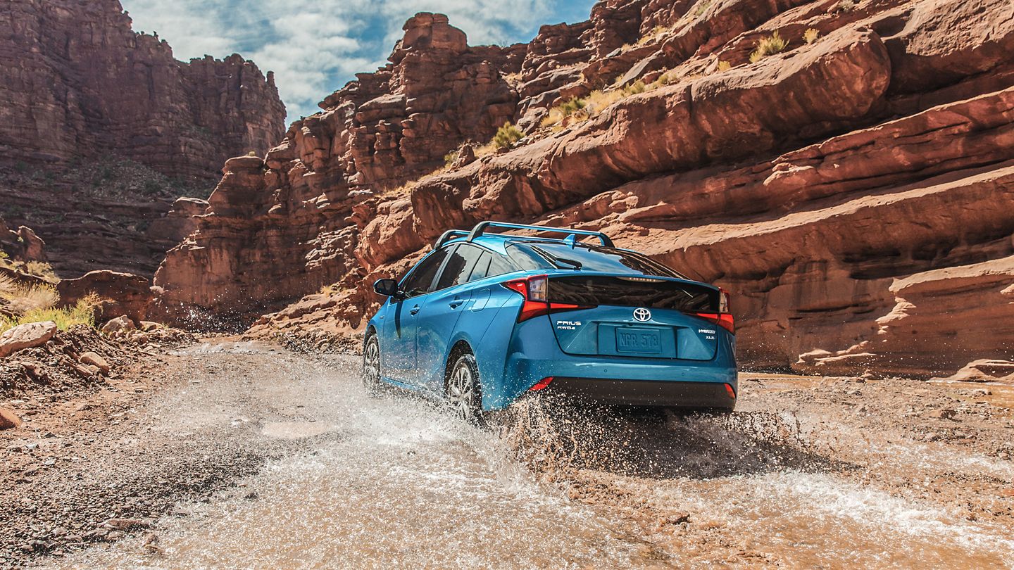 2022 Toyota Prius driving through the mud
