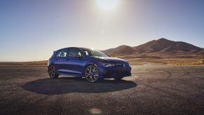 A blue 2022 Volkswagen Golf R shot from the 3/4 angle
