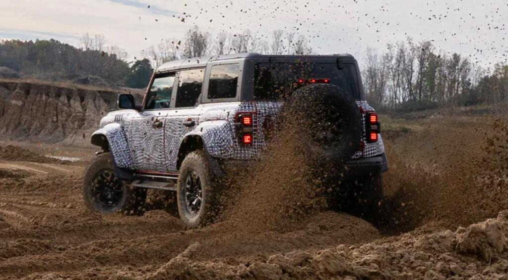 Ford Bronco Raptor off-road SUV ripping through the mud