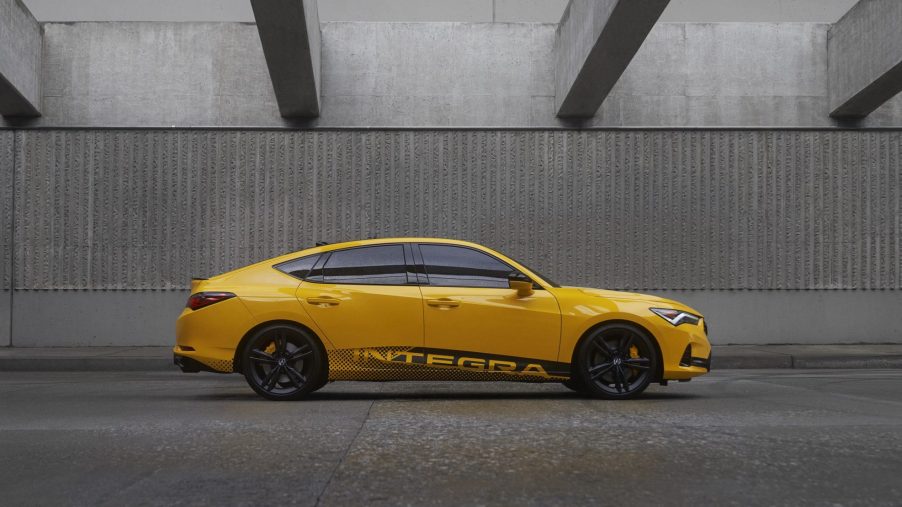 A profile shot of the 2023 Acura Integra in yellow