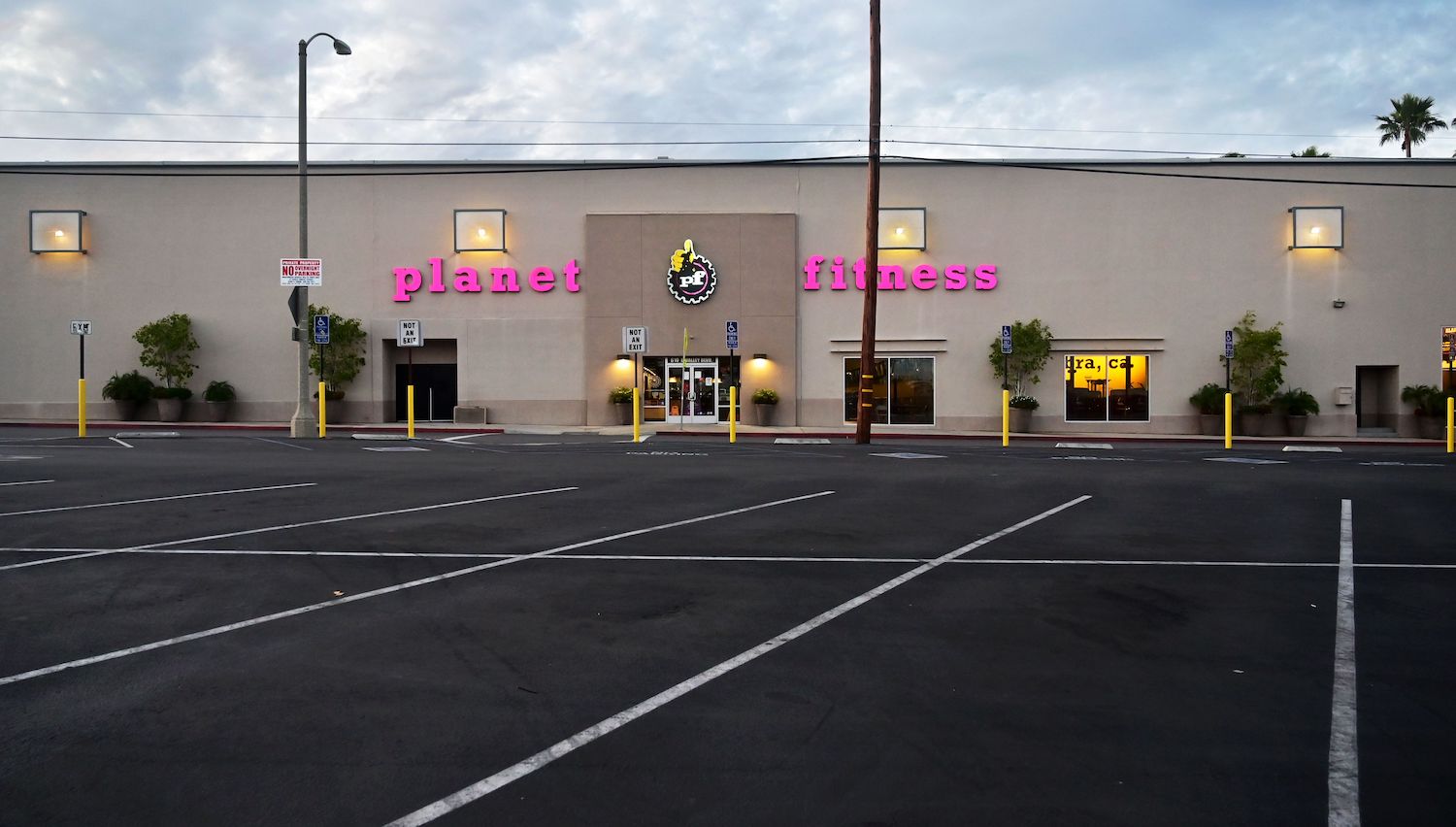The empty Planet Fitness gym parking lot is not necessarily a legal place to sleep in your car. | Frederic J. Brown/AFP via Getty Images