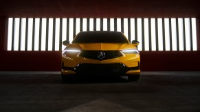2023 Acura Integra Prototype painted in Indy Yellow Pearl photographed inside a parking garage. This prototype will be the base for the 2023 Acura Integra