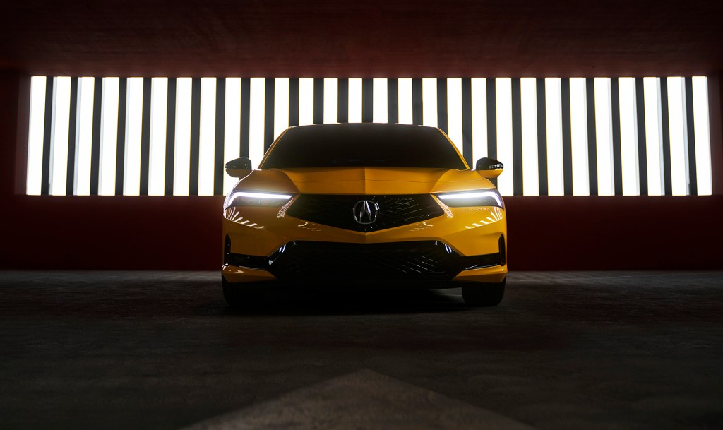 2022 Acura Integra Prototype painted in Indy Yellow Pearl photographed inside a parking garage. This prototype will be the base for the 2023 Acura Integra