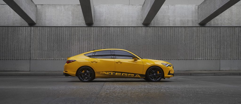 2023 Acura Integra Prototype painted in Indy Yellow Pearl photographed inside a parking garage. This prototype will be the base for the 2023 Acura Integra