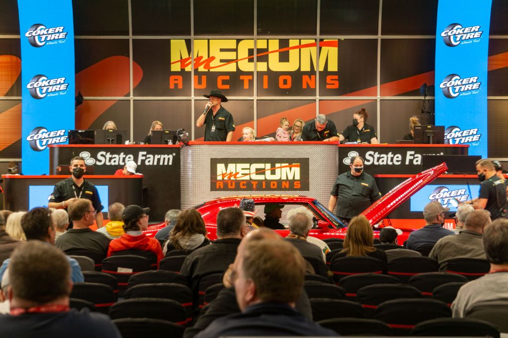 An auctioneer calls for bids at the 2021 Chicago Mecum auction