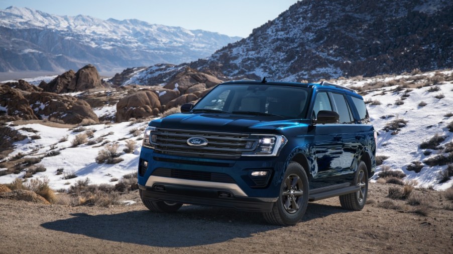 Black 2022 Ford Expedition, a good SUV for sleep, with snowy mountains in the background