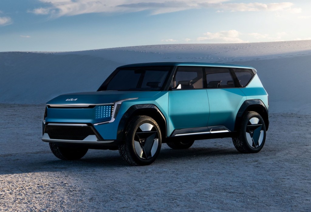 Blue-green 2024 Kia EV9 electric SUV parked in the desert