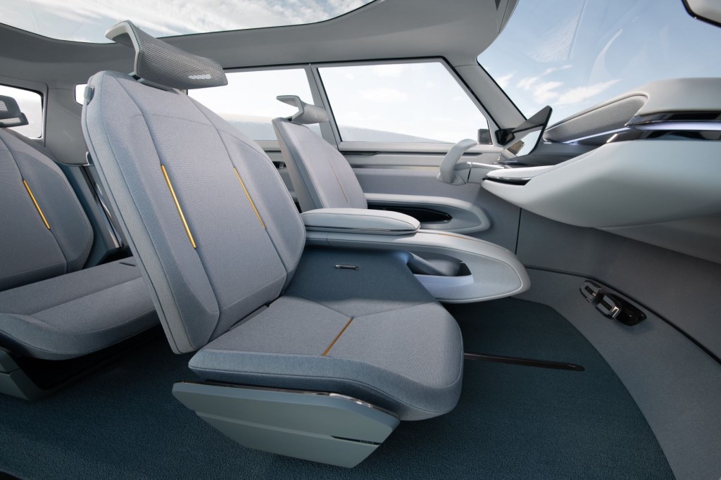 Dashboard, seats, touchscreen, steering wheel, and panoramic sunroof in 2024 Kia EV9 electric SUV