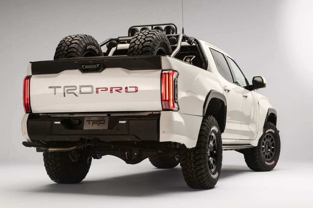 A white Desert Chase 2022 Toyota Tundra TRD Pro from the rear quarter angle with a white background