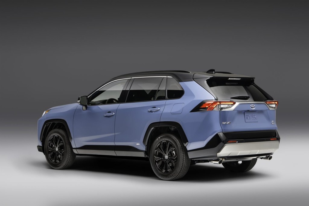 Driver's side rear angle view of 2022 Toyota RAV4 XSE with Cavalry Blue color option