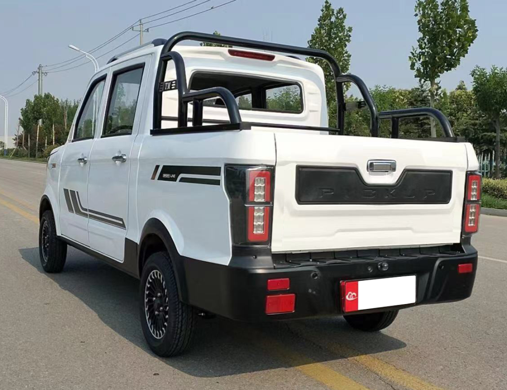 Driver's side rear angle view of white mini ChangLi electric truck sold on Alibaba in China