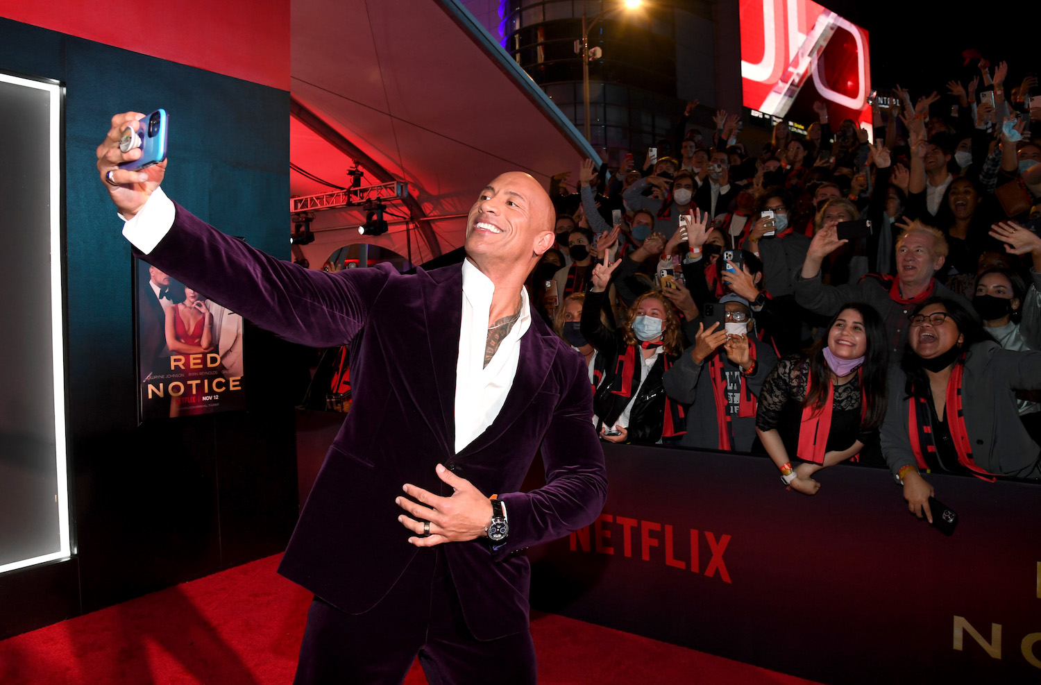 This is Dwayne Johnson, star of Red Notice, in which he drove a Porsche Taycan | | Kevin Mazur/Getty Images for Netflix