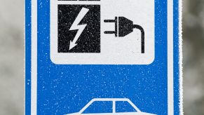 Electric car charging station sign in winter