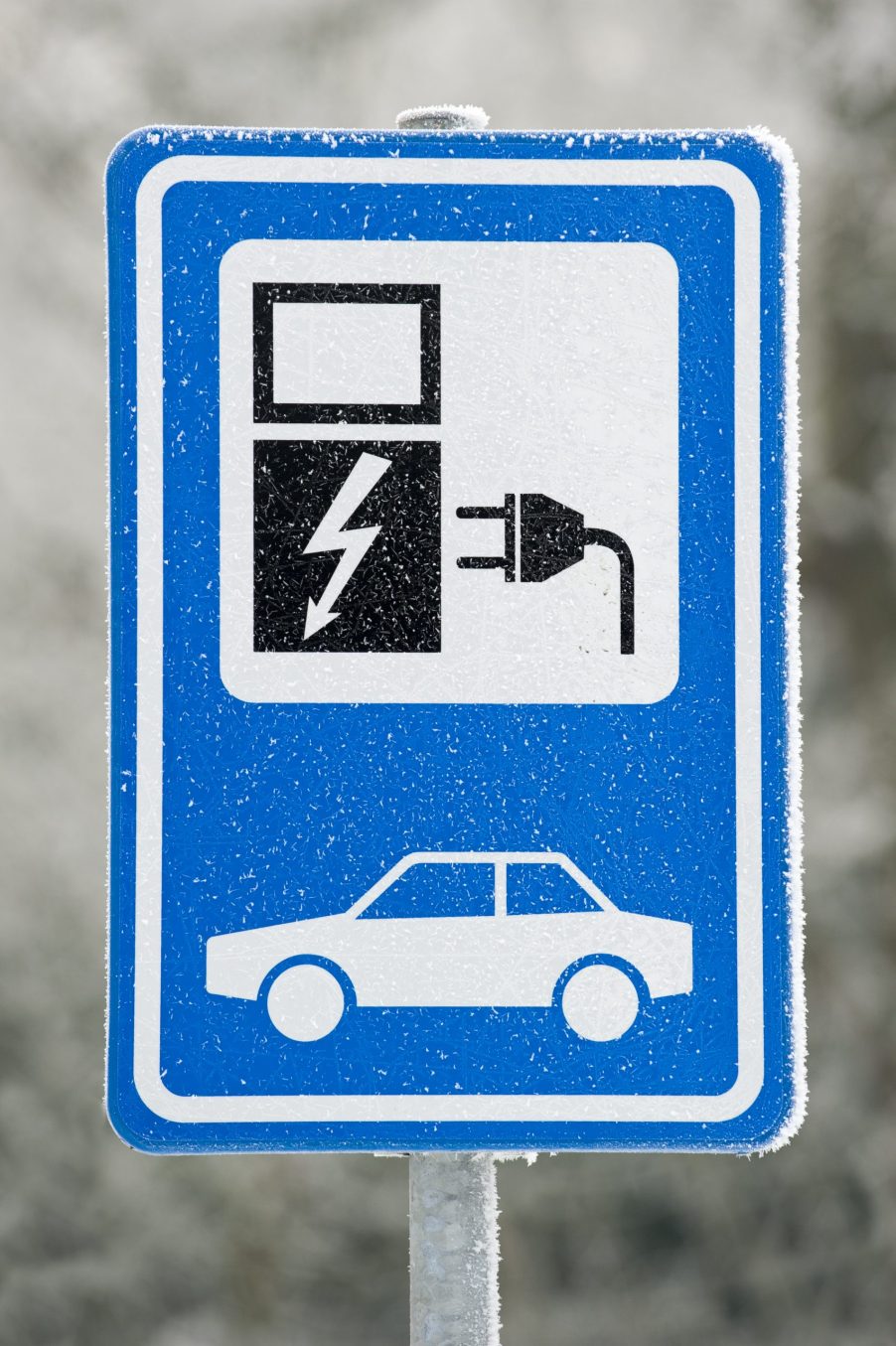 Electric car charging station sign in winter