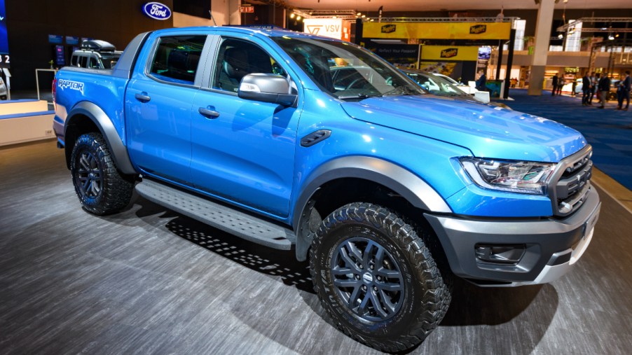 A blue Ford Ranger is on display.