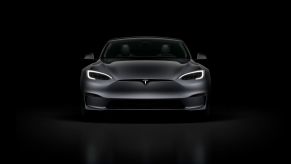 Front view of black Tesla Model S and Tesla Sentry Mode with Darth Vader voice feature