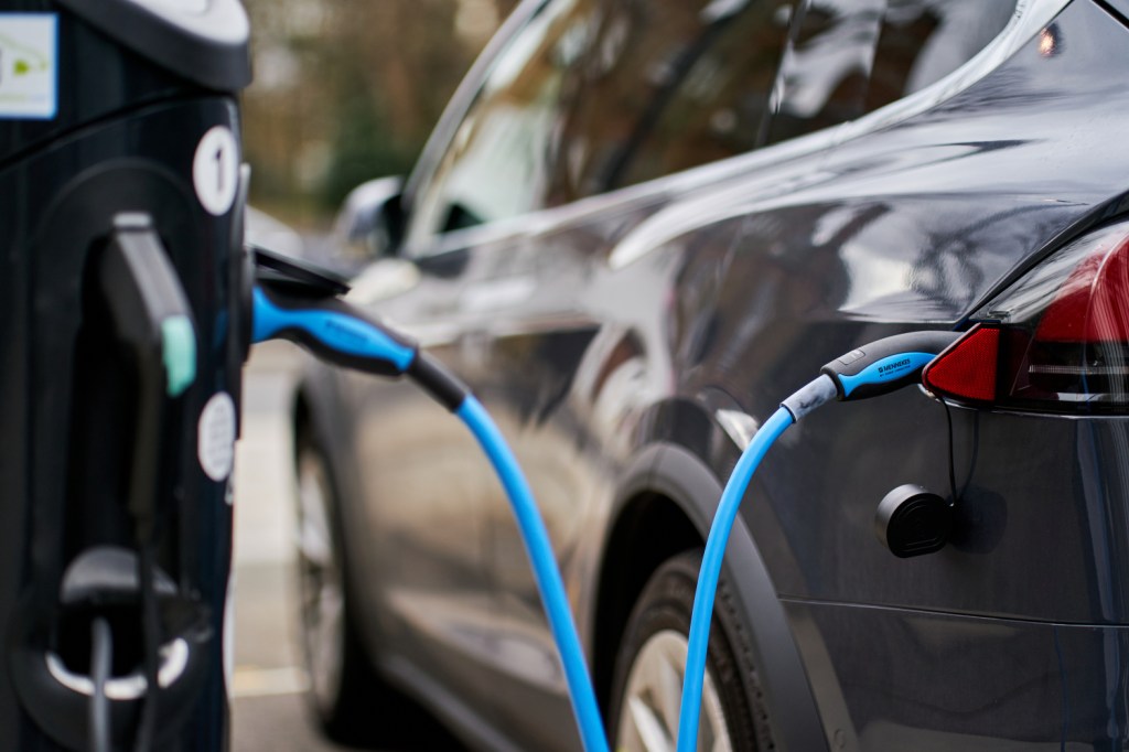 Homes and businesses in England will have to install electric vehicle chargers