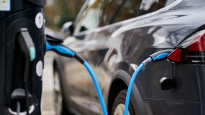 Homes and businesses in England will have to install electric vehicle chargers