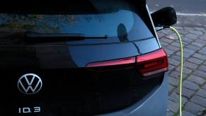 An electric vehicle plugged in to charge