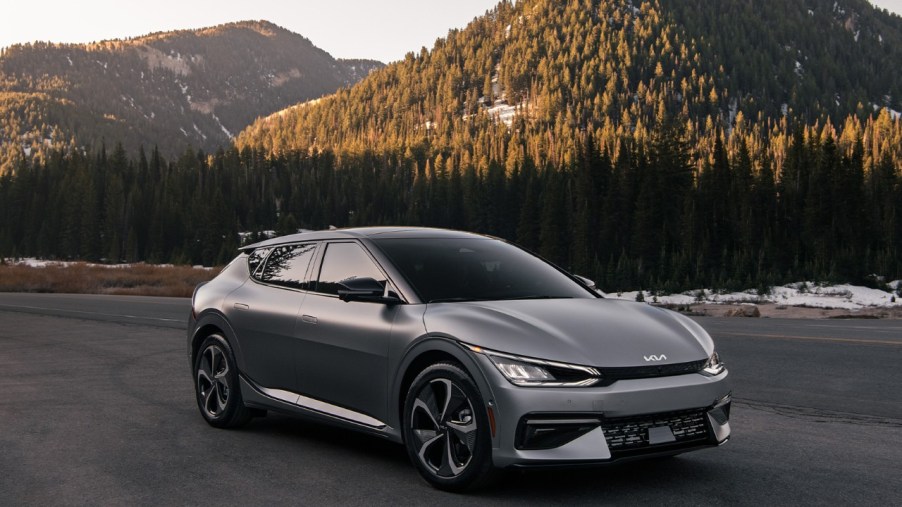 Gray 2022 Kia EV6 electric crossover SUV with mountains in the background