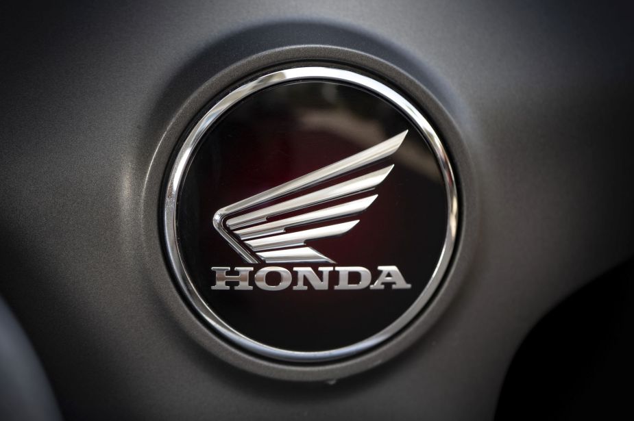 A black and white Honda logo on a grey background.