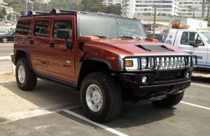 A Hummer H2 full-size SUV model parked at the 