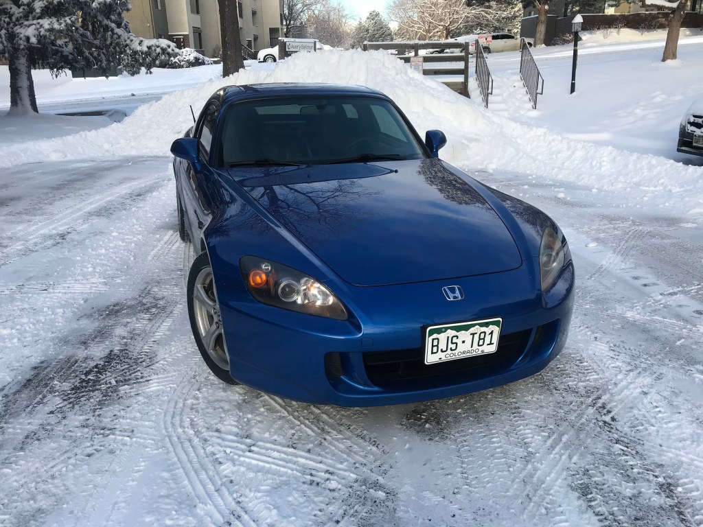 A Honda S2000 parked in the snow