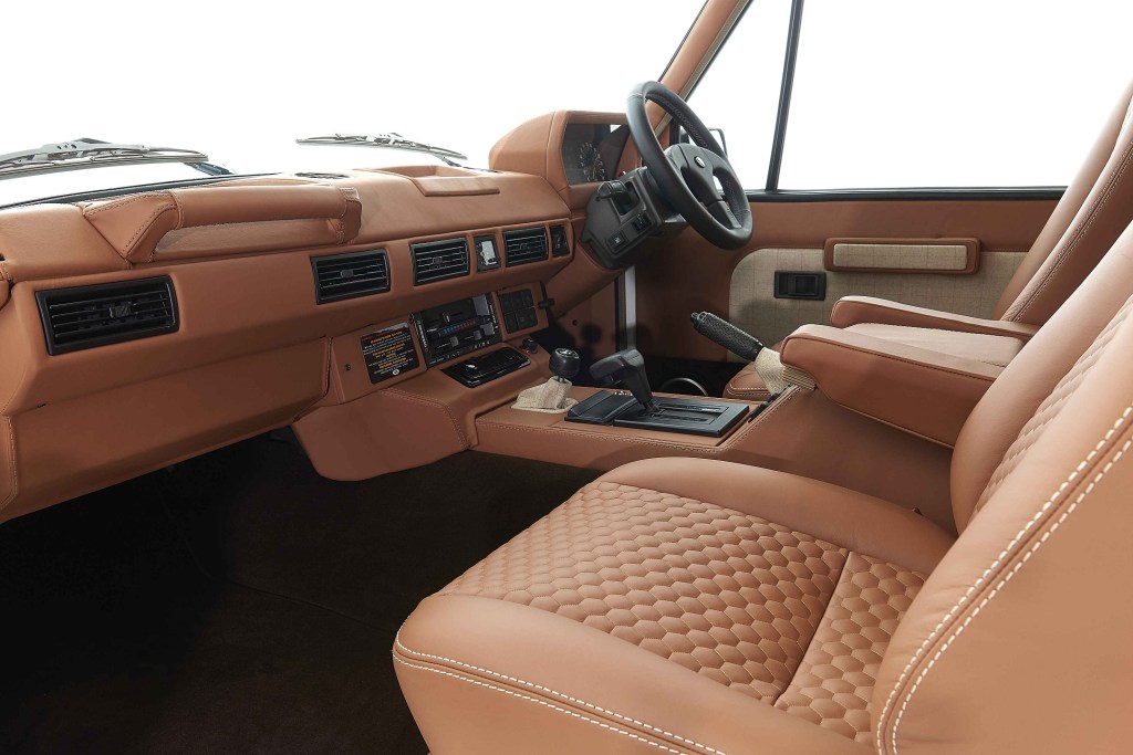 The tan-leather-upholstered front seats and dashboard of a RHD Kingsley Cars KR Series 1992 Range Rover Classic
