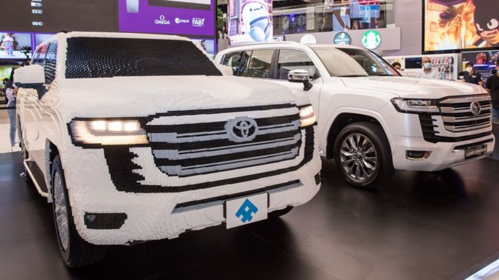 A white LEGO Toyota Land Cruiser SUV model built life-size for a dealership in United Arab Emirates