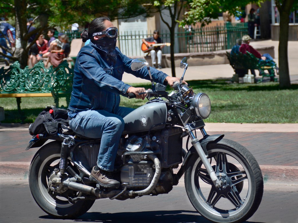 Man riding his Honda motorcycle