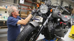 Man working on Victory motorcycle