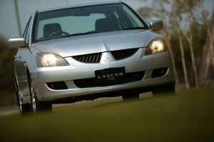 The Mitsubishi Lancer MX compact sedan with a gray silver paint color option