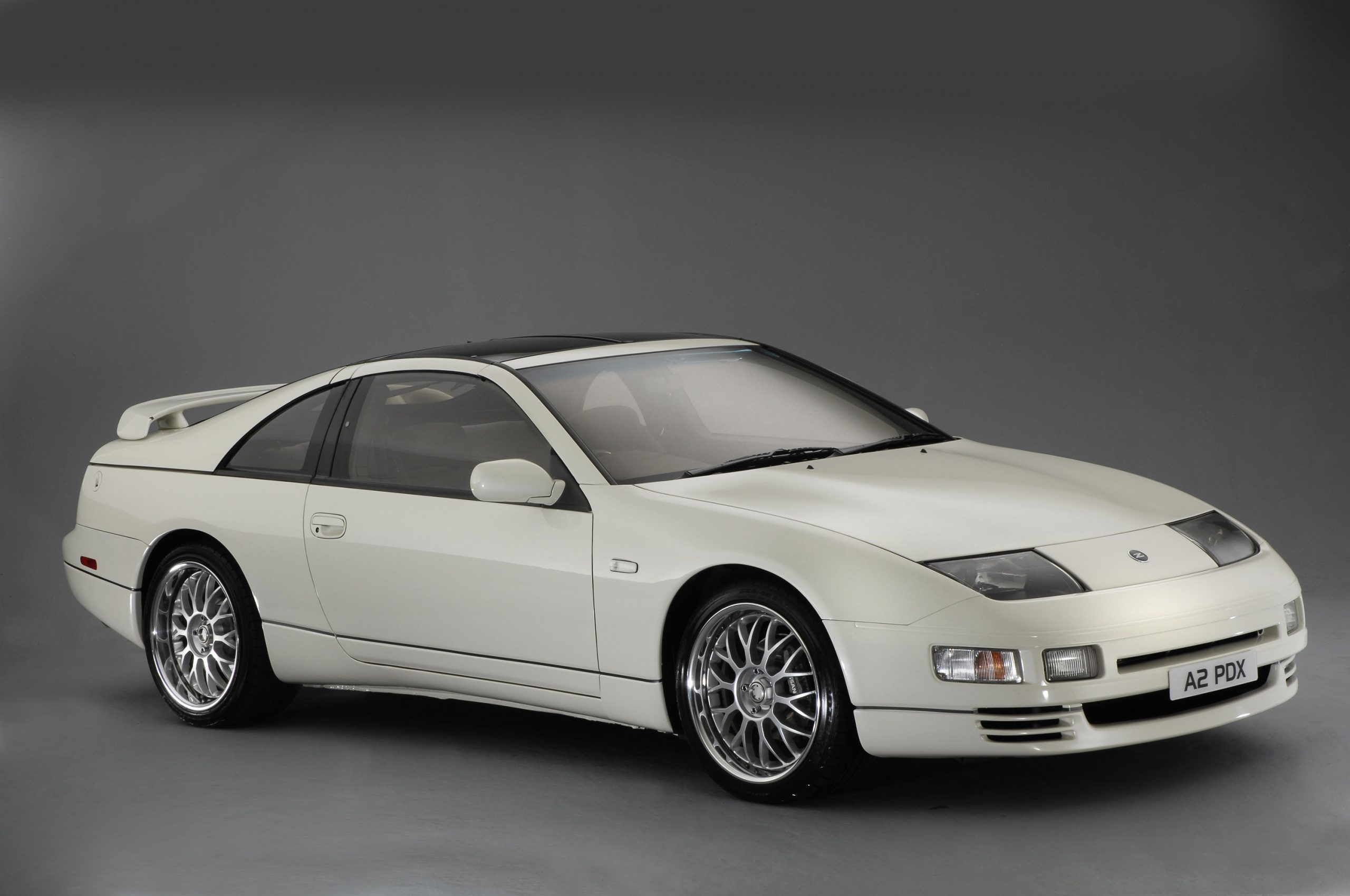 A white Nissan 300ZX, powered by the VG30 engine shot from the front 3/4