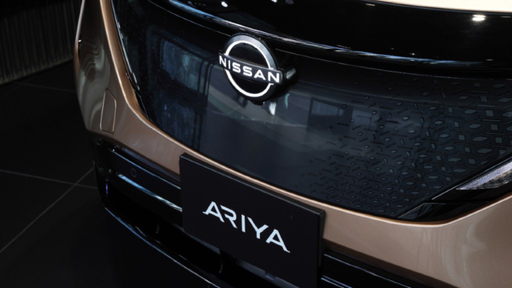 The front of a peach colored 2023 Nissan Ariya.