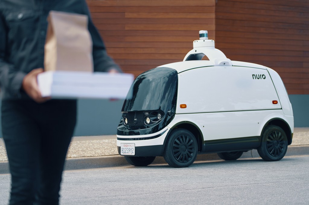 The Nuro R2 Autonomous vehicle parked on the side of a road