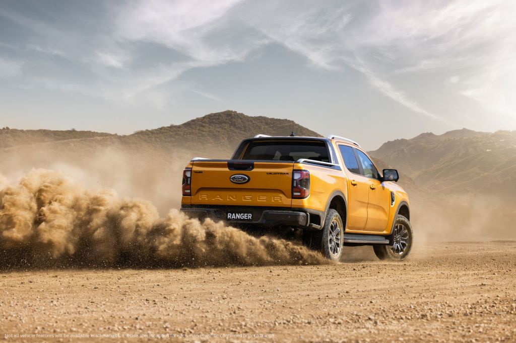 Orange 2023 Ford Ranger driving off-road near mountains: A Ranger Raptor to follow?