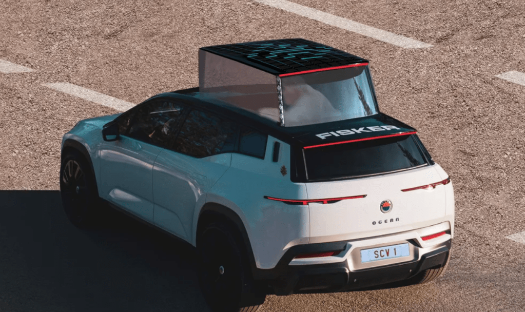 Pope Francis sitting inside a Fisker Ocean Popemobile crossover EV