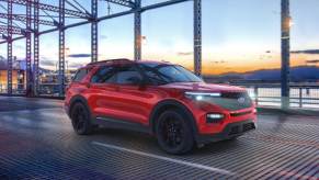 Red 2022 Ford Explorer driving over a bridge
