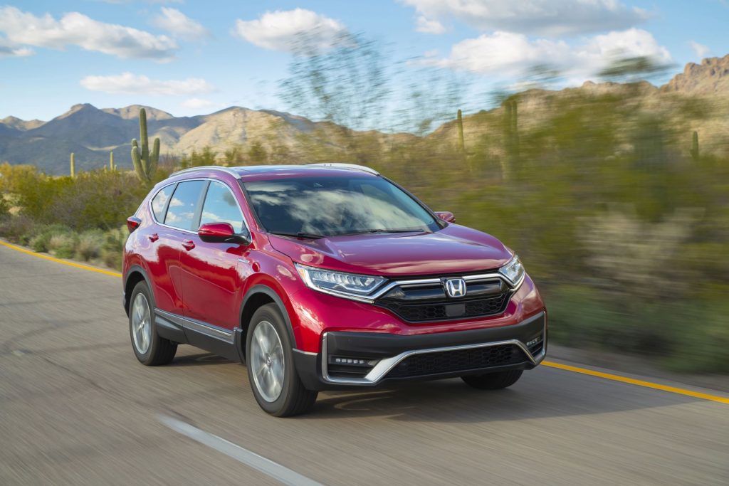 Red 2022 Honda CR-V Touring drivng on a desert road