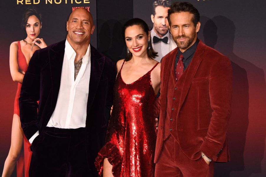 Dwayne Johnson, Gal Godot, and Ryan Reynolds | PATRICK T. FALLON/AFP via Getty Images